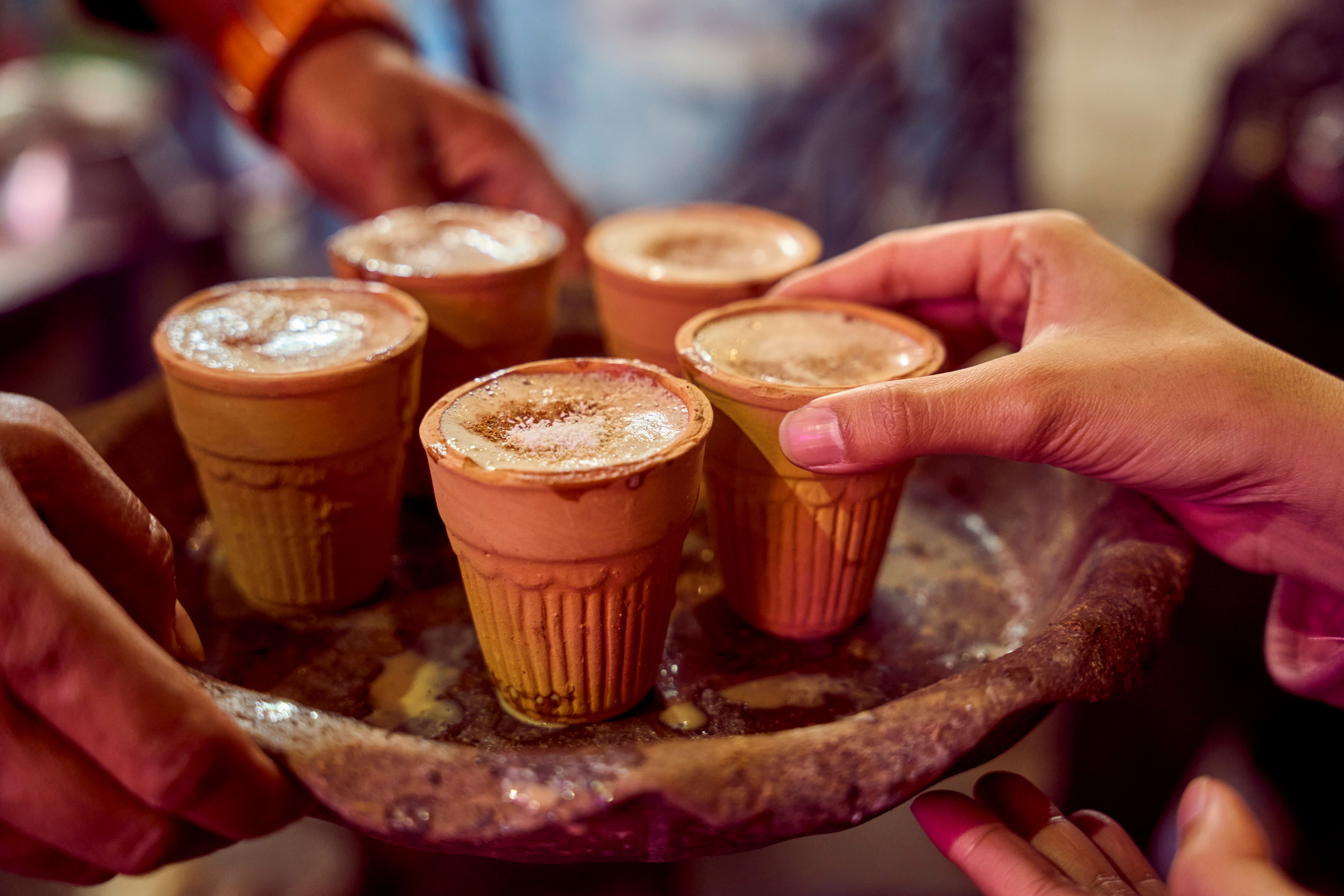 Kullad chai being poured fresh